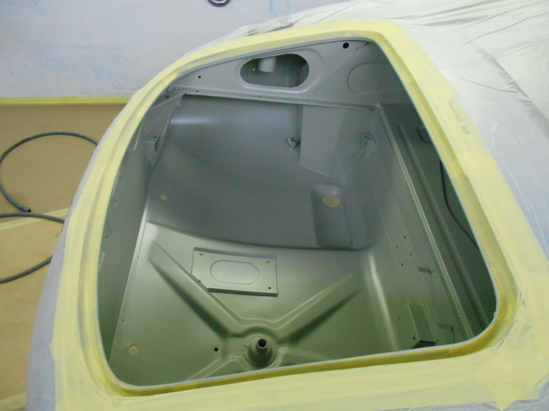 Jaguar E-Type paintwork - trunk area prepared and in epoxy primer ready for topcoat