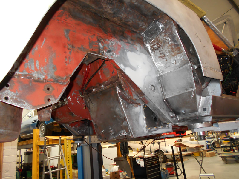 Aston Martin DB6 Volante Restoration -right hand wheel house underseal removed