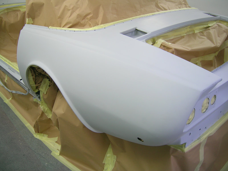 Aston Martin V8 paintwork -
rear masked ready for topcoat