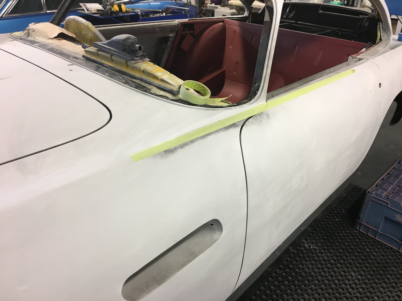 Aston Martin DB5 Restoration - taping off body lines to ensure they remain straight and correct