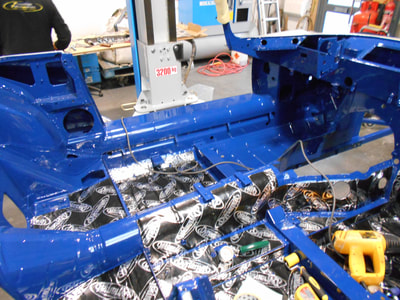 Jaguar E-Type restoration -
Dynamat being installed