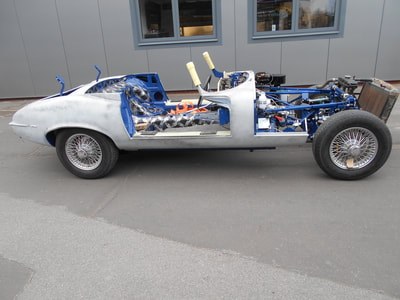 Jaguar E-Type restoration -
Exterior all prepped ready for making then into colour