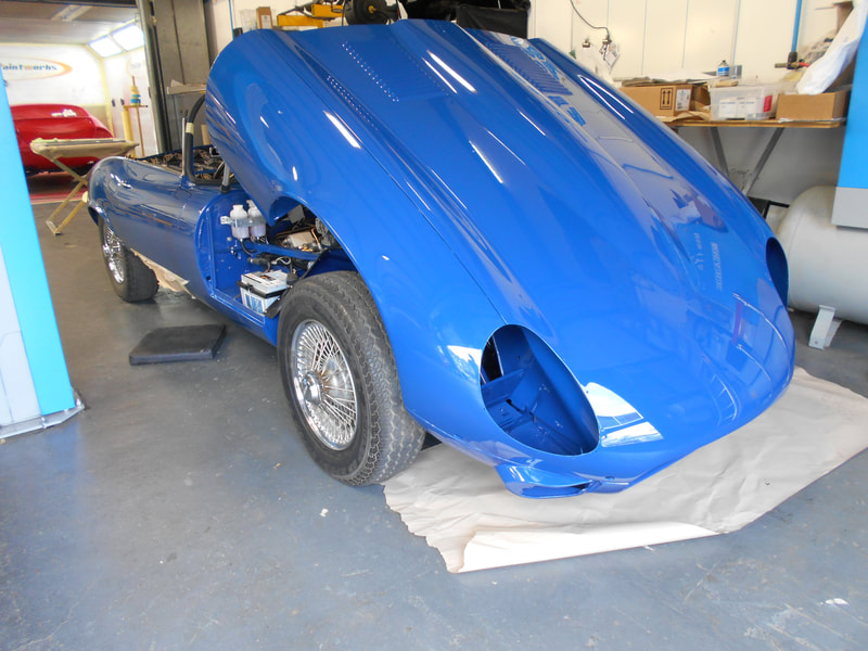 jaguar E-type restoration - starting to look like a car with its body panels re fitted
