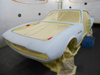 Aston Martin DBS Restoration -
Masked ready for 2nd round of spray polyester