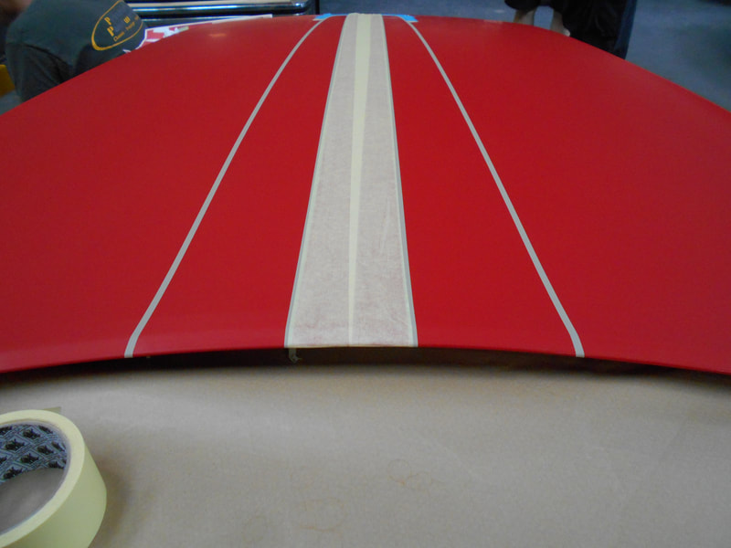 bonnet painted and now in the process of Ferrari 430 paintwork - having the Scuderia stripes masked then painted
