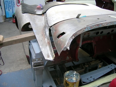 Jaguar XK140 restoration - bulkhead corner, wing section all removed to get the car correct